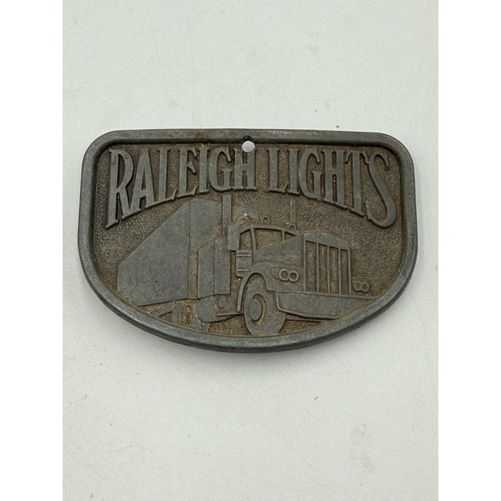 Vintage Raleigh Lights Semi Truck Belt Buckle Promo Cast Metal Silver‎